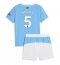 Fotbollsset Barn Manchester City John Stones #5 Hemmatröja 2025-26 Mini-Kit Kortärmad (+ korta byxor)